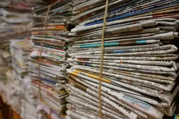 large stacks of old news papers