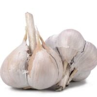2 bulbs of garlic isolated on a white background
