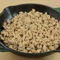 Cooked ground turkey in a cast iron skillet