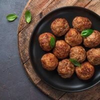 Overhead view of meatballs in a cast iron skillet