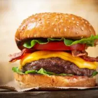 Close up of a fully loaded hamburger