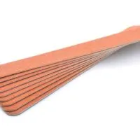 Fanned out stack of emery boards on a white background