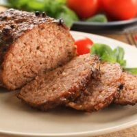 Meatloaf, sliced on a white plate